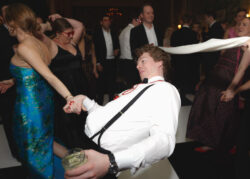Guests limbo on the dance floor at River Oaks Country Club