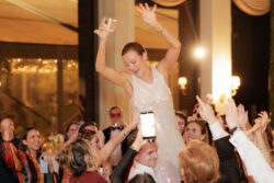 The bride is lifted high