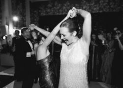 The bride dances with a guest
