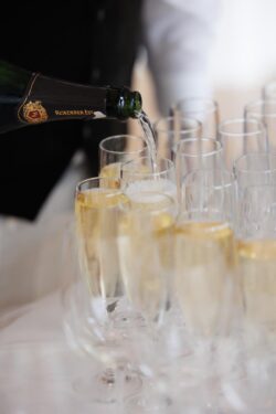 Champagne is poured at a wedding rehearsal dinner at Brennan's of Houston