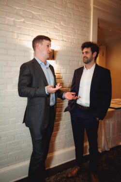 Guests chat at a wedding rehearsal dinner at Brennan's of Houston
