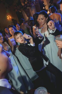 A young guest dances at a Houston Country Club wedding in Texas