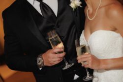 The bride and groom with champagne, wedding photography at The Houstonian Club, Houston Texas