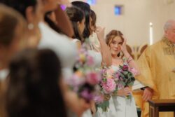 Bridesmaids wipe away tears in church