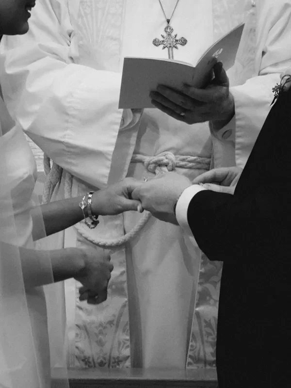 A couple exchange rings at their wedding ceremony
