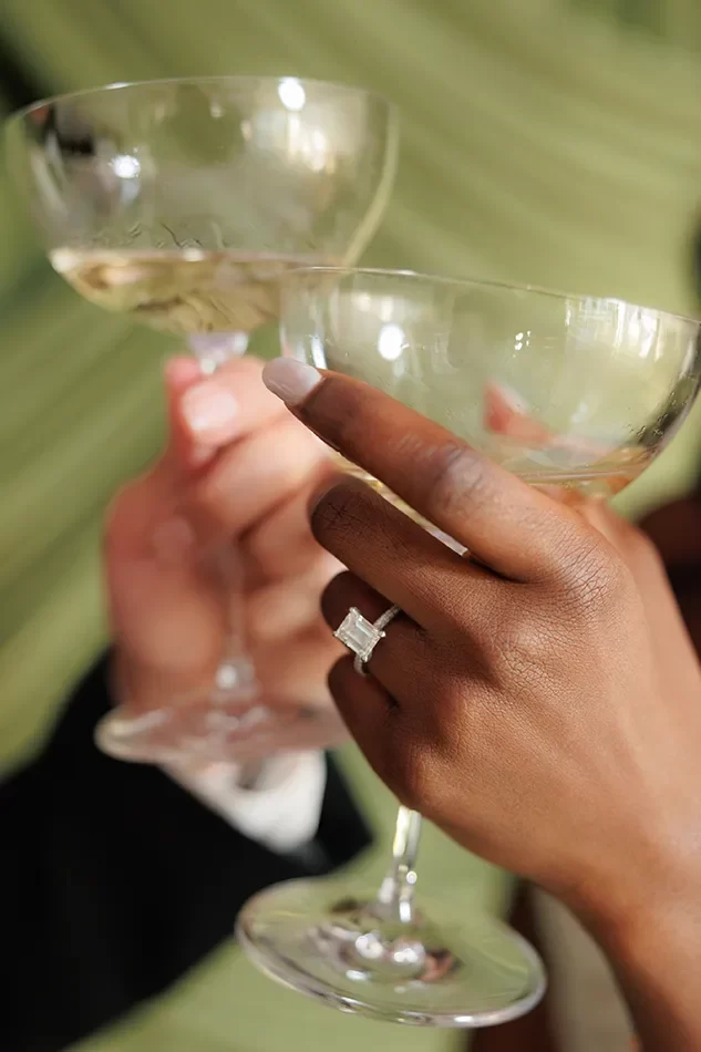 Close hand detail of a couple toasting at a Houston wedding